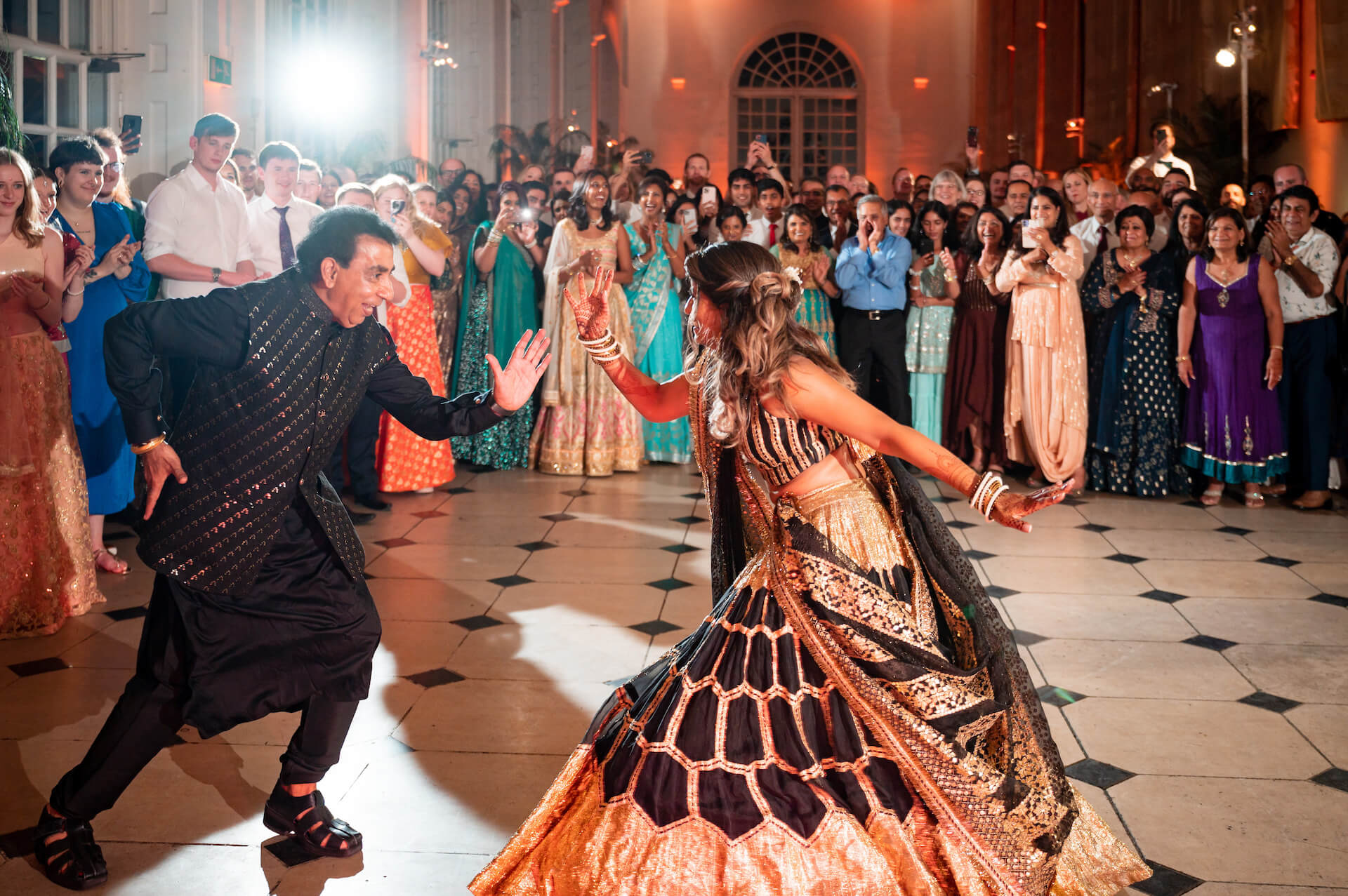 Puja and her dad dancing during her wedding.